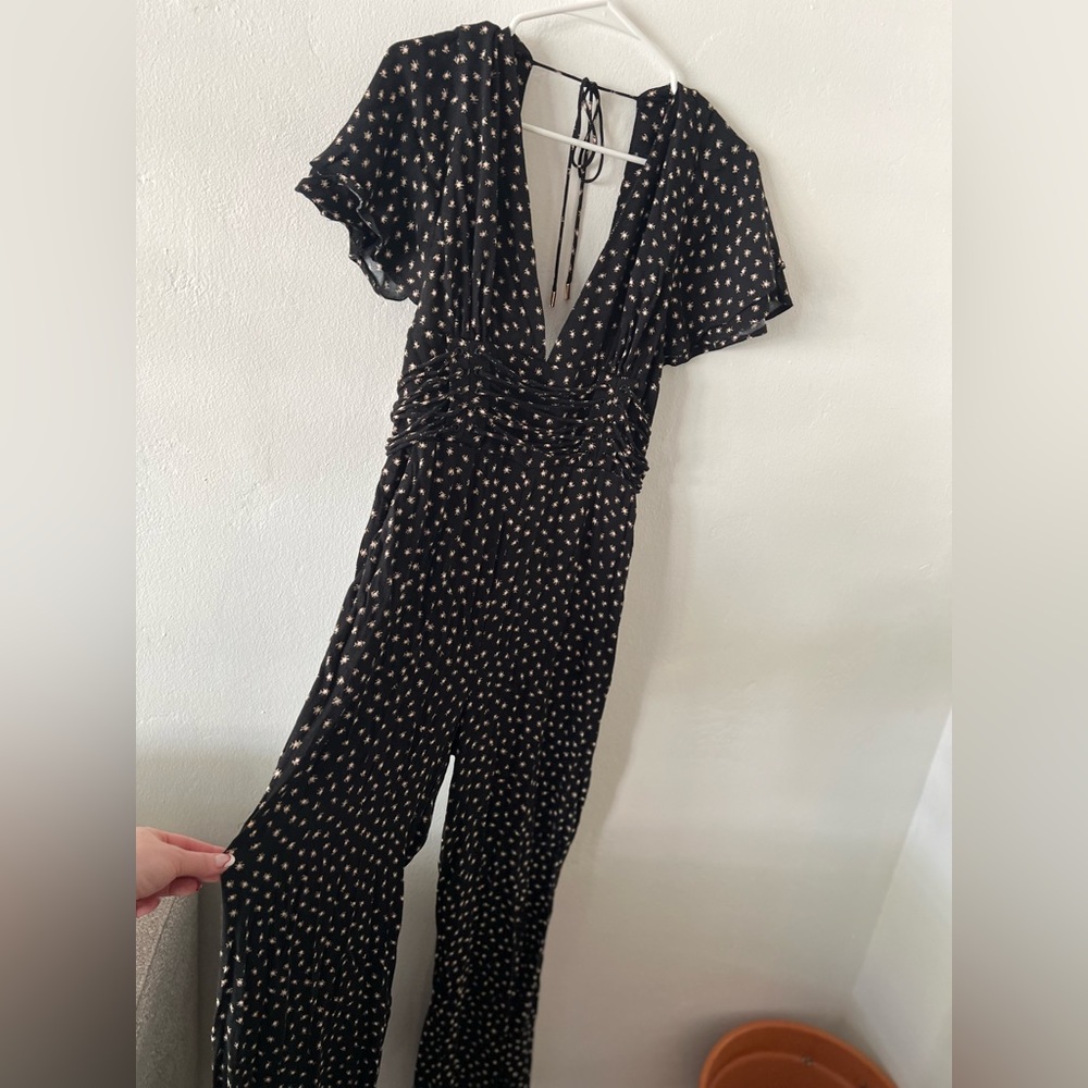 AFRM Jumpsuit. Open back, deep plunge